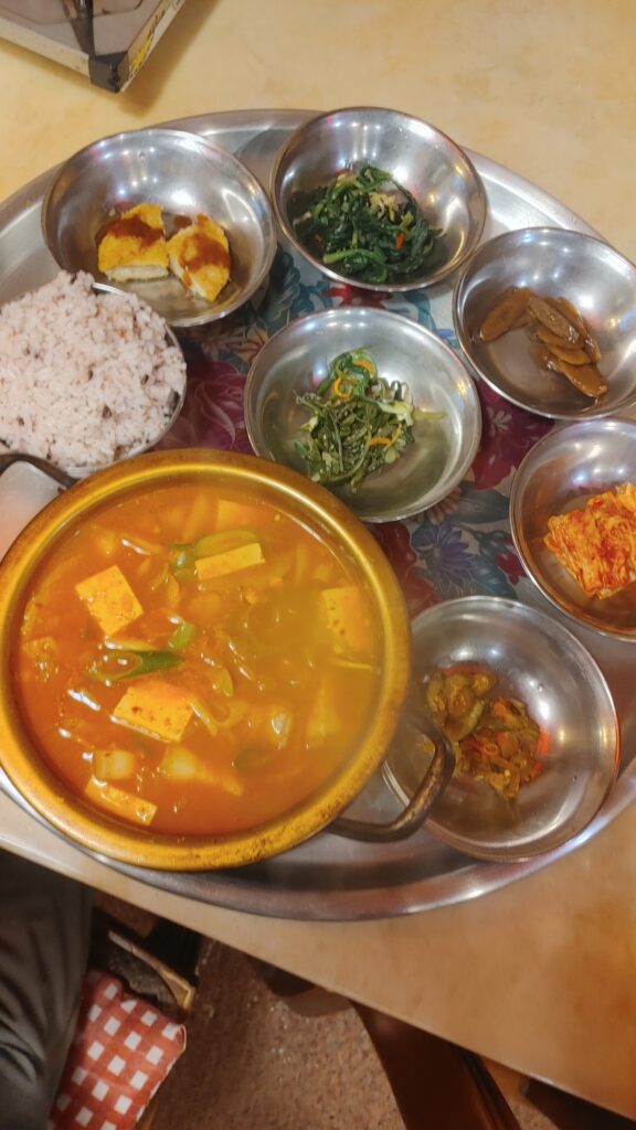 Korean baekban rice meal with soup and side dishes - kimchi jiegae