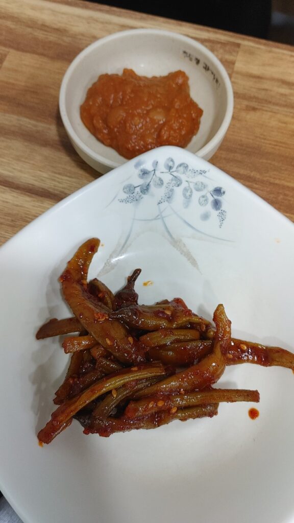 Seasoned Garlic Scapes - Seasoned with red pepper powder, gochujang, and other spices (lightly boiled)